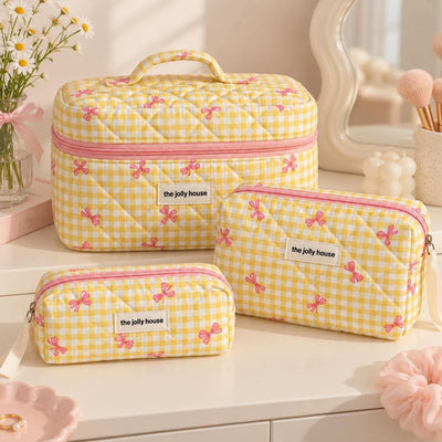 Trousse matelassée à nœuds