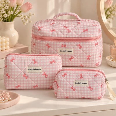 Trousse matelassée à nœuds