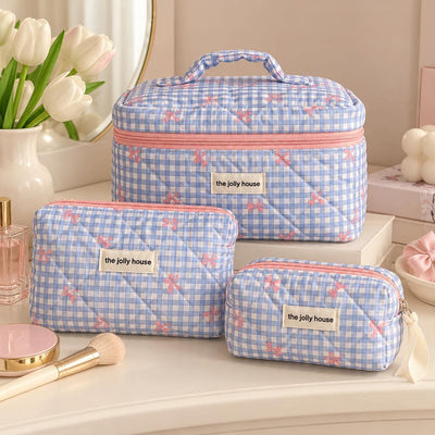 Trousse matelassée à nœuds