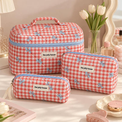 Trousse matelassée à nœuds